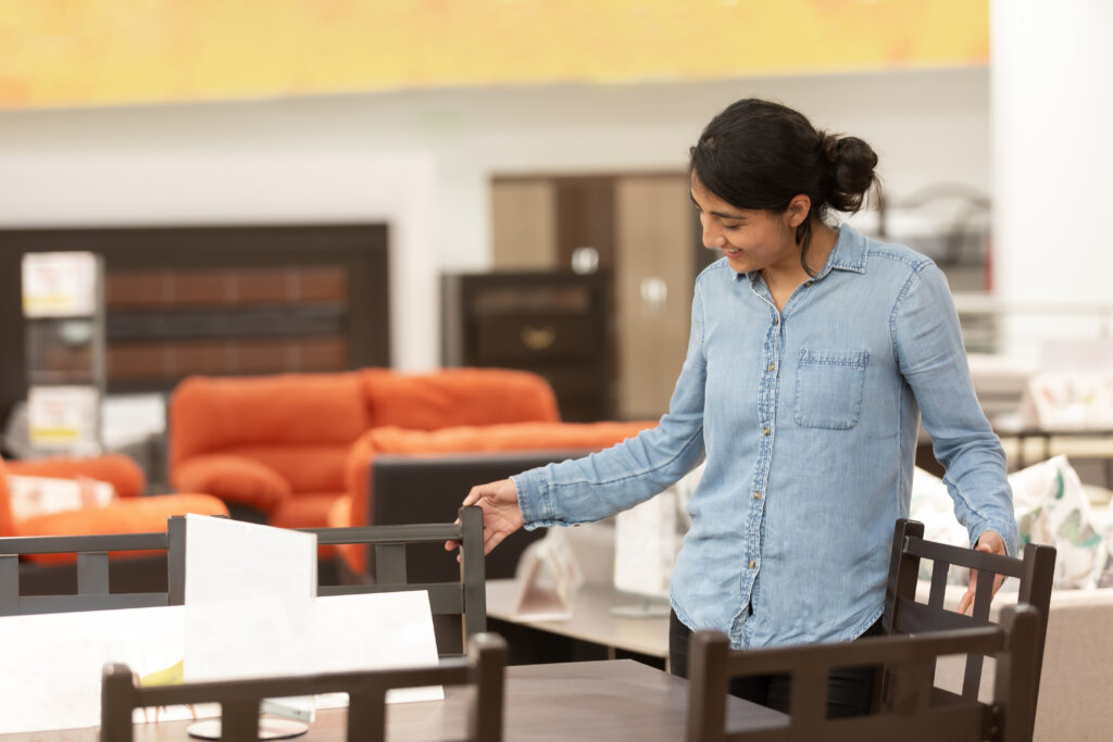 Woman shopping for furniture at a furniture store in Kolkata