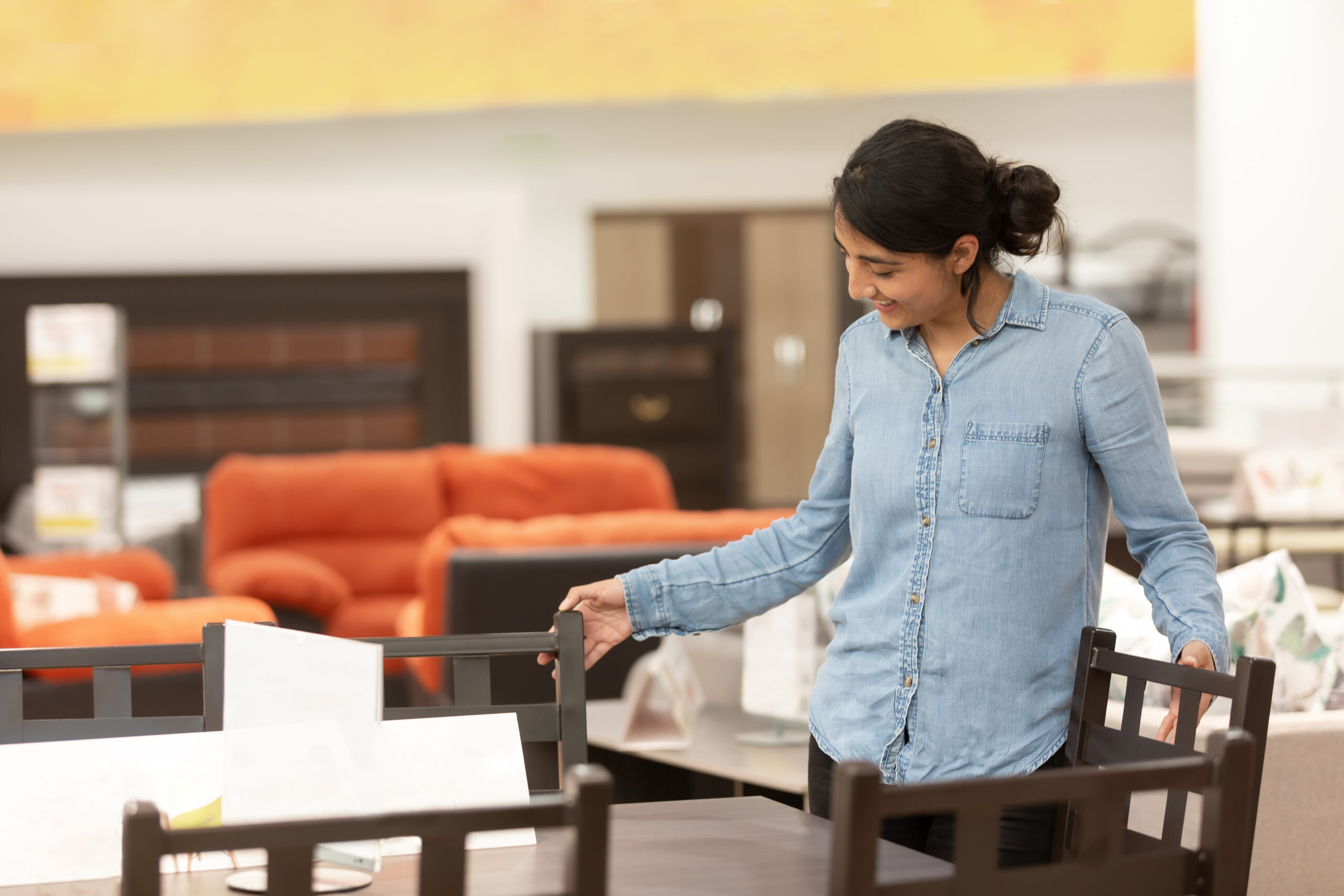 Woman shopping for furniture at a furniture store in Kolkata